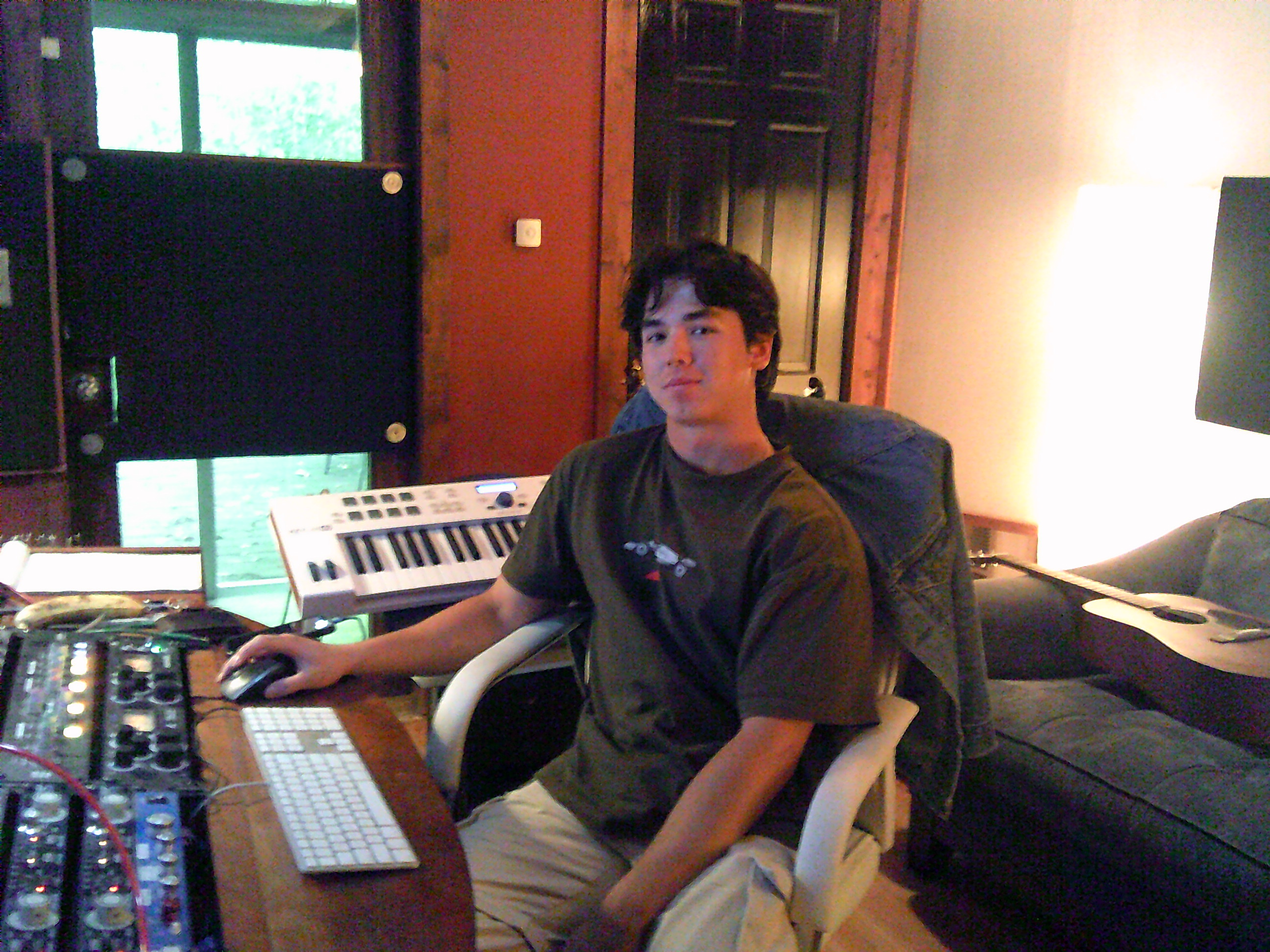 Studio desk: monitors, MIDI controller, audio chain